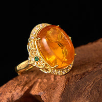 KarmaRipple's Amber Flower Pigeon Egg Pattern Focus Ring