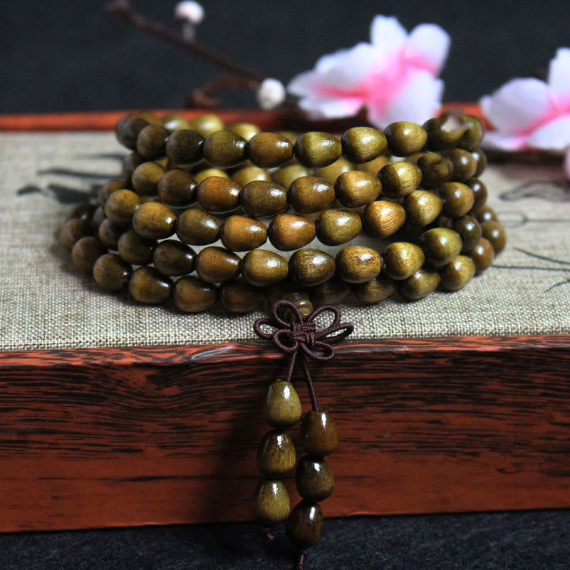 KarmaRipple's 108 Mala Teardrop Beadwork Authentic Phoebe Zhennan Wood Protection Bracelet p1